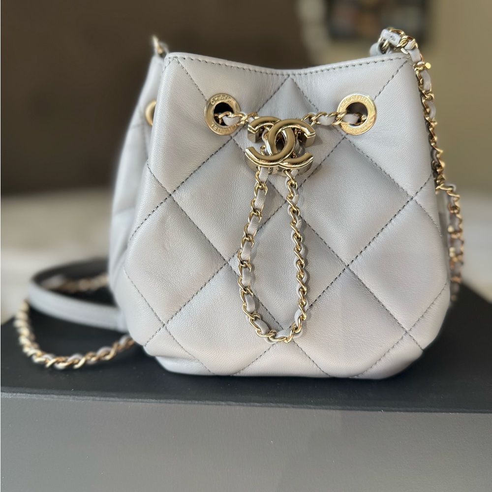 AUTHENTIC CHANEL Gray Quilted Mini Bag with Gold Accents.
